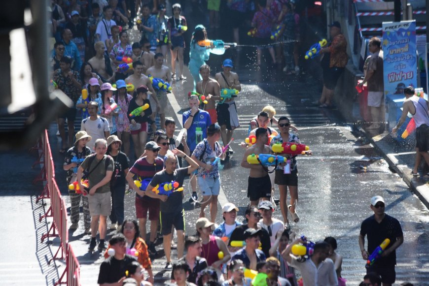 Hottest spot in Bangkok! Silom Road is packed with tourists flocking to celebrate the last day of Songkran.